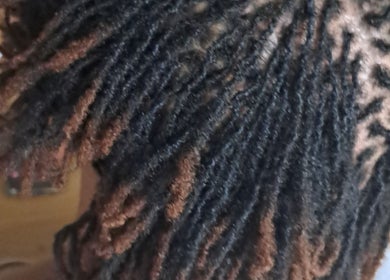 Intricate dreadlock style at Loctician en route, Cape Town, Western Cape, ZA.