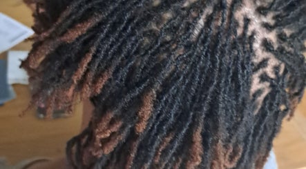 Intricate dreadlock style at Loctician en route, Cape Town, Western Cape, ZA.
