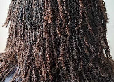 Dreadlocks hairstyle by Loctician en route in Cape Town, Western Cape, ZA, showcasing detailed texture.