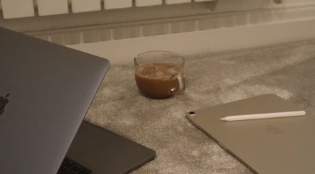 Cozy workspace with laptops and coffee at ByMacyAsh, Stoke-on-Trent, England, GB.