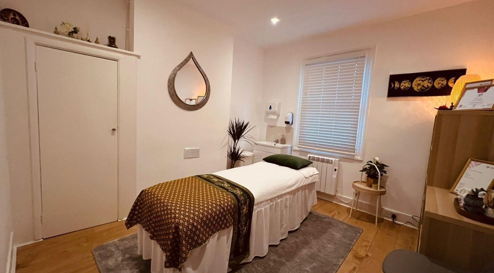 Tranquil massage room at Bexley Thai Massage in Bexley, England, GB featuring a cozy bed and calming decor.