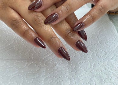 Elegant burgundy manicure at Nails By Fila, Durban, Kwazulu-natal, ZA showcasing sleek, polished nails.