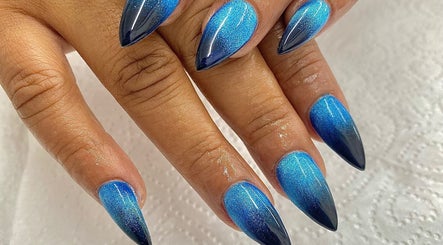 Stunning blue gradient nails by Nails By Fila in Durban, Kwazulu-natal, ZA. Glamorous and chic design.