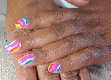 Colorful nail art at Lallie Nail Studio in Potchefstroom, North West, ZA showcasing rainbow design.