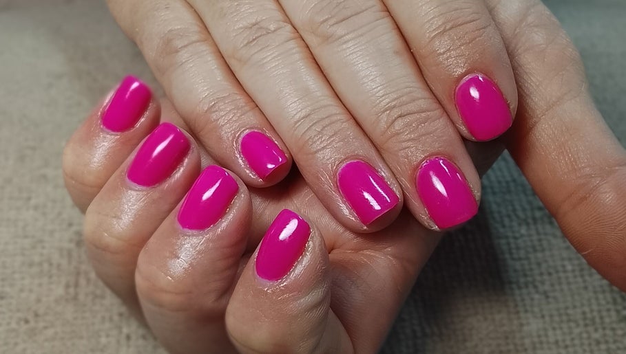 Vibrant pink manicure at Lallie Nail Studio, Potchefstroom, North West, ZA, showcasing glossy nail art.