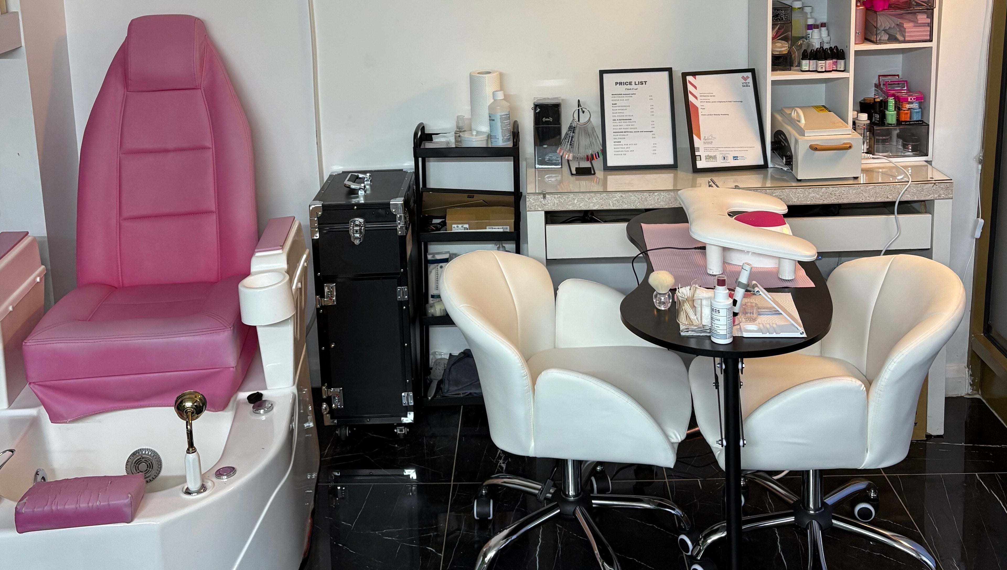 Stiletto Vault in Wembley, England, GB features luxe pink pedicure chairs and cozy manicure stations.