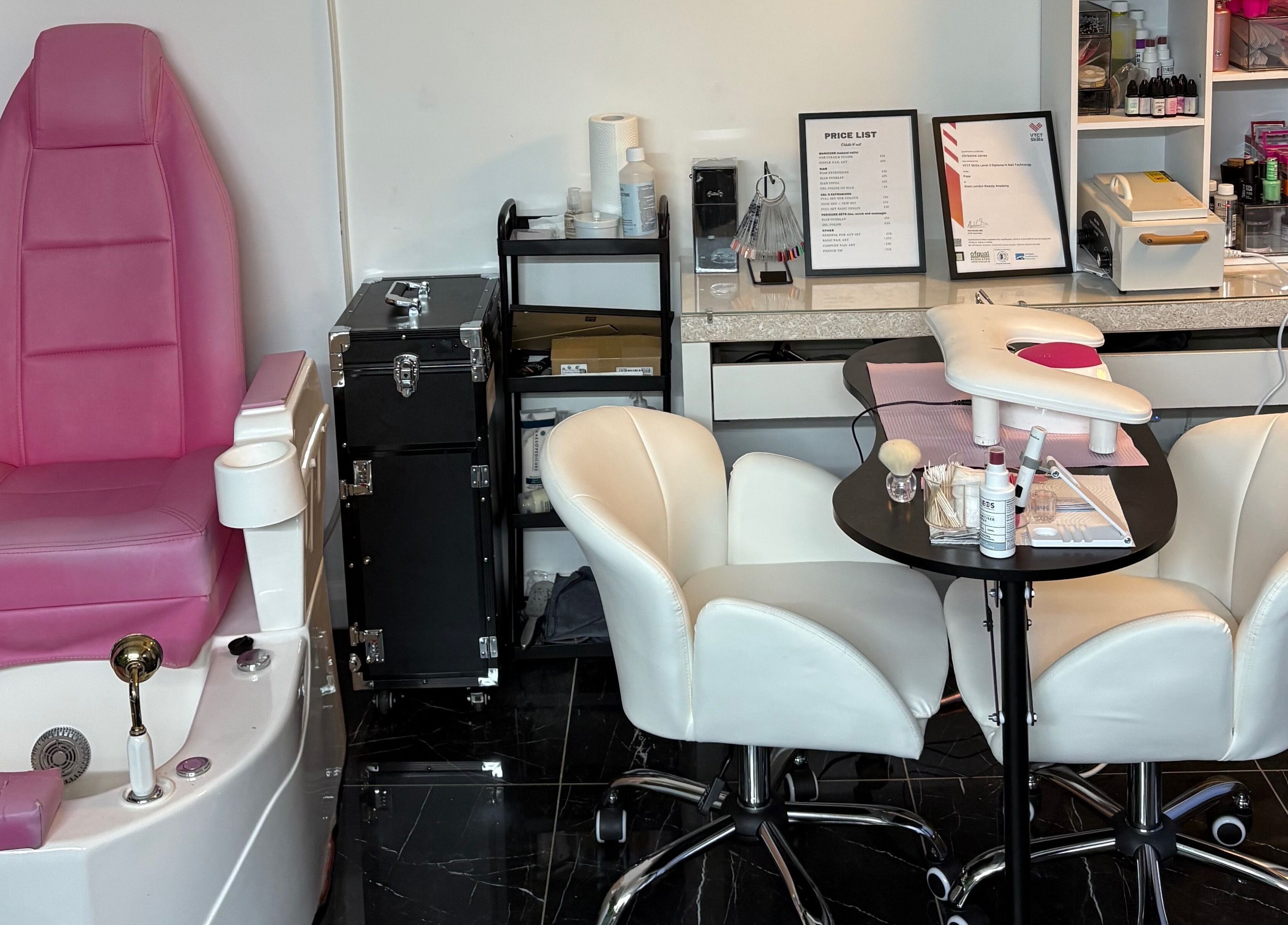 Stiletto Vault in Wembley, England, GB features luxe pink pedicure chairs and cozy manicure stations.
