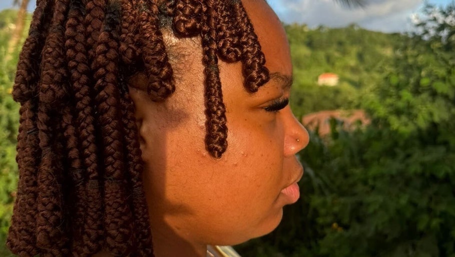 Side profile of intricate braids at Hair .Byann, Kingstown, VC.