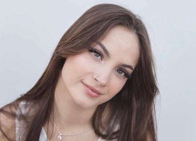 Woman with serene expression at Comfort Beauty, Christchurch, Canterbury Region, NZ.