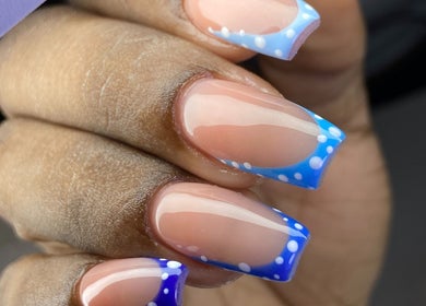 Stylish blue polka dot nails at Kshine Aesthetics, Willemstad, Curaçao, CW. Perfect for a chic look.