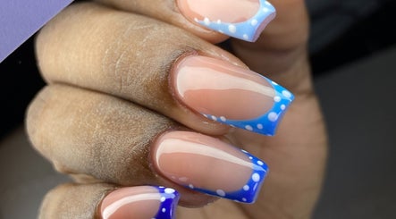 Stylish blue polka dot nails at Kshine Aesthetics, Willemstad, Curaçao, CW. Perfect for a chic look.