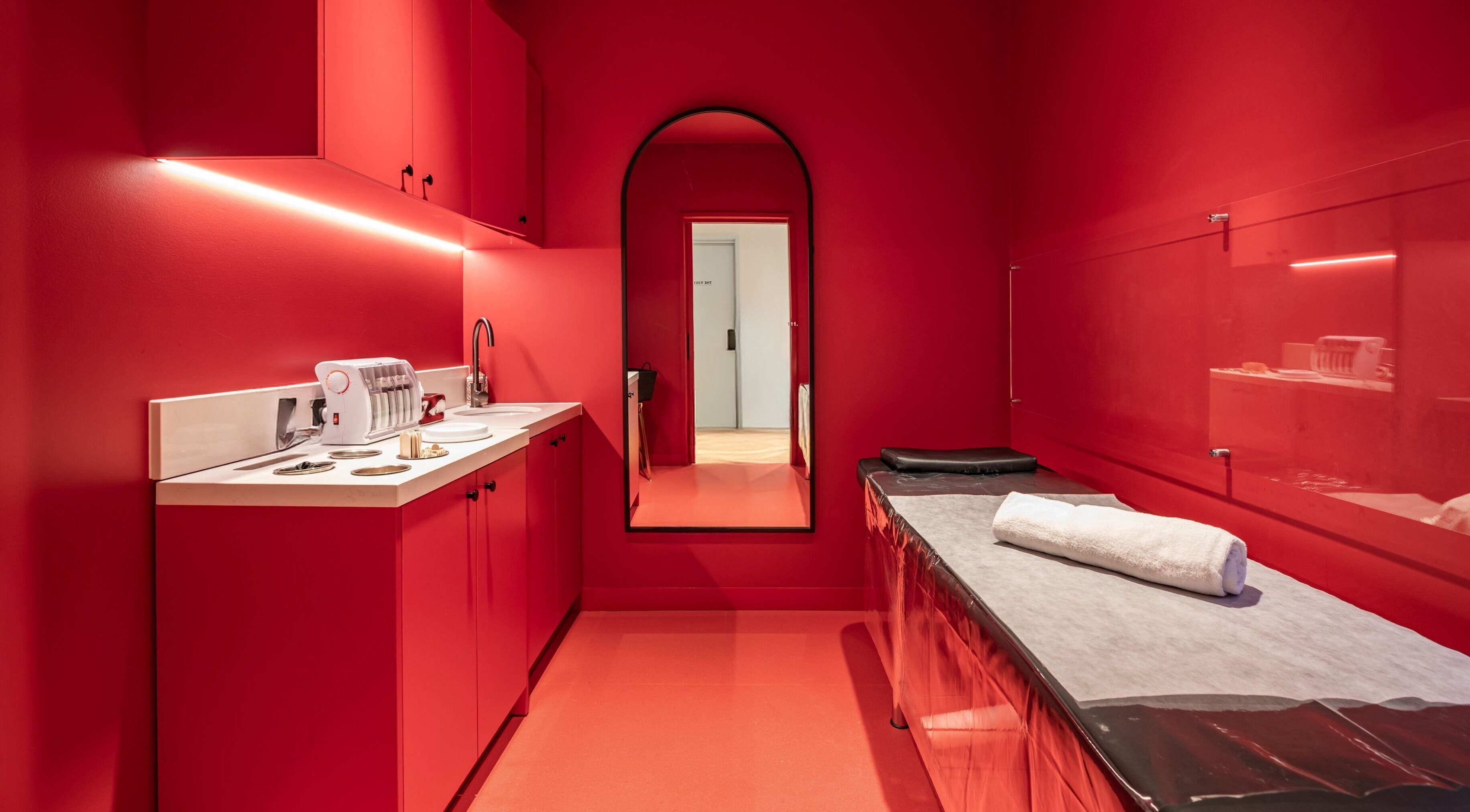 Luxurious spa room at My Julie in Moonee Ponds, Victoria, AU featuring a modern red interior design.