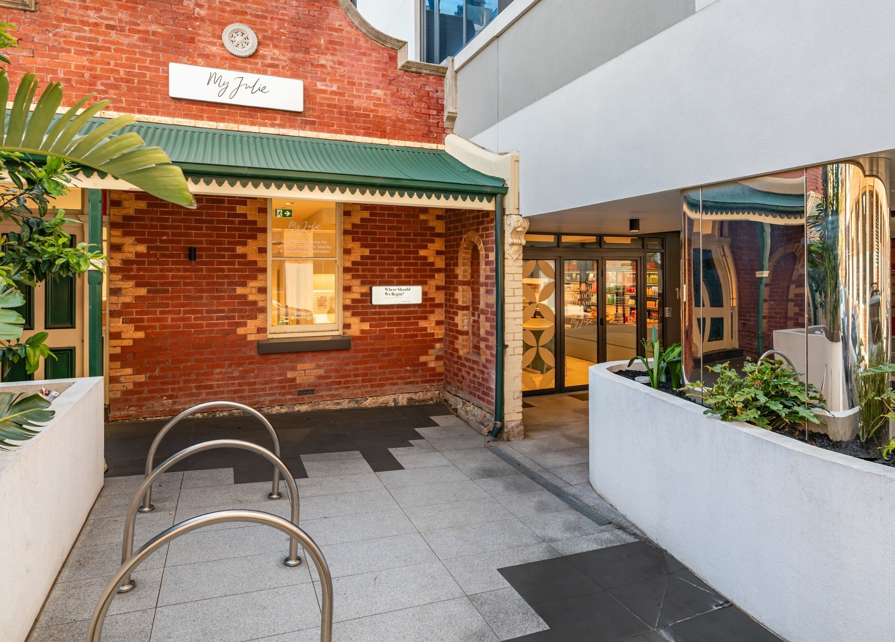 Entrance of My Julie beauty and wellness venue in Moonee Ponds, Victoria, AU with lush greenery.