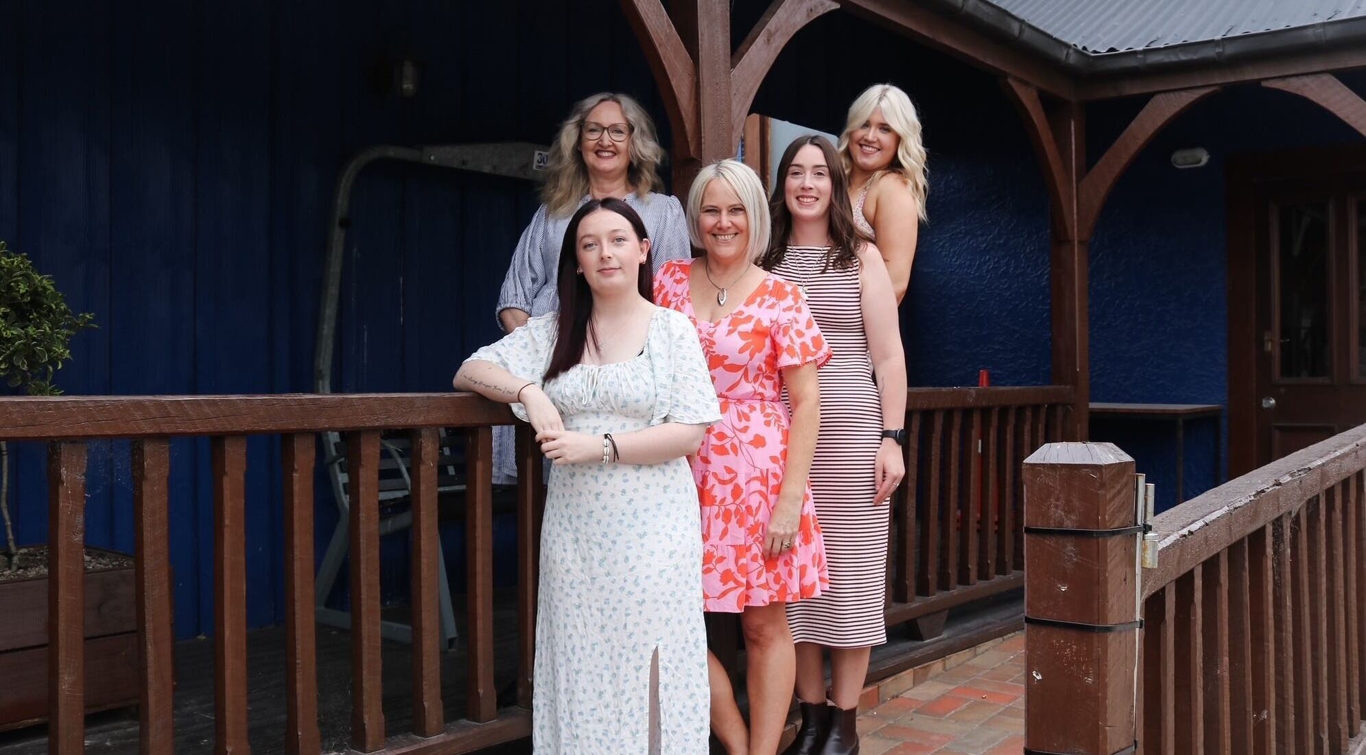 Clippers Hair Studio staff posing on the wooden deck in Ashburton, Canterbury Region, NZ.