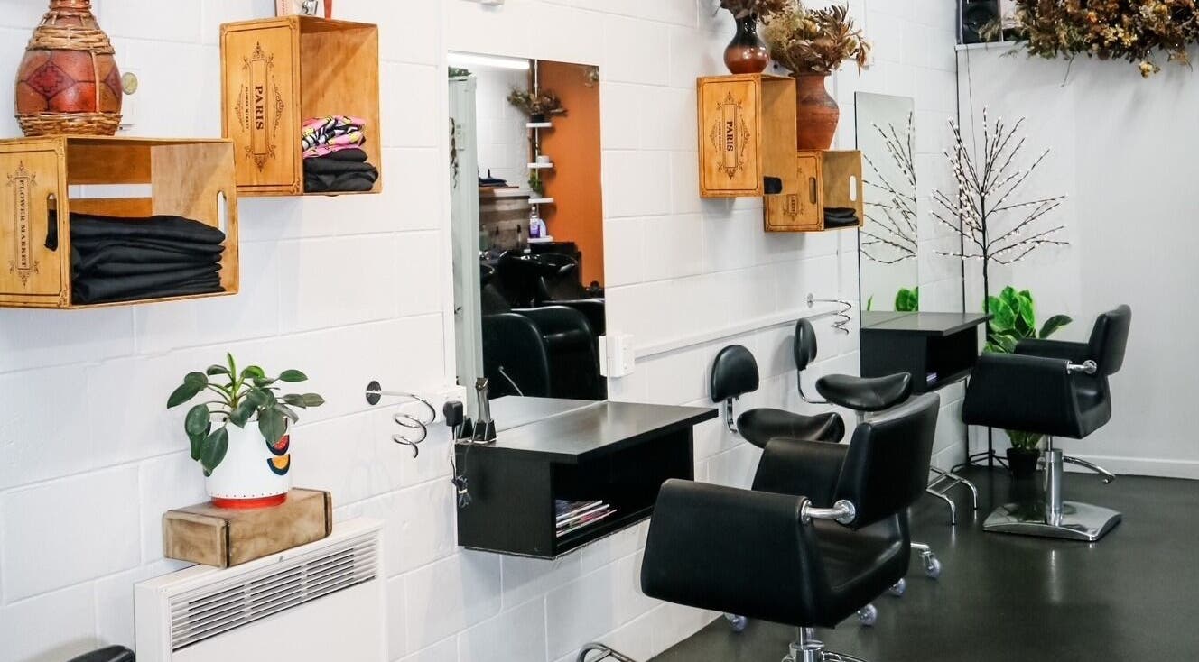 Interior of Clippers Hair Studio in Ashburton, Canterbury Region, NZ featuring stylish chairs and mirrors.