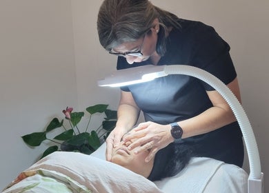 Expert facial at Hina's Beauty Work Ltd in Auckland, NZ. Gentle skincare treatment under soft lighting.
