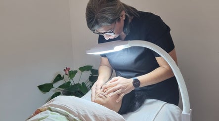 Expert facial at Hina's Beauty Work Ltd in Auckland, NZ. Gentle skincare treatment under soft lighting.