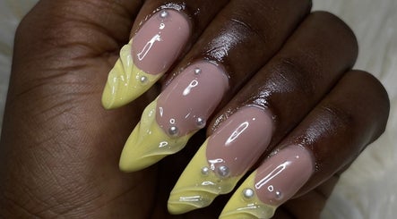 Elegant lemon and nude nails with pearl accents from Omosi Nails Studio, Lagos, Lagos, NG.