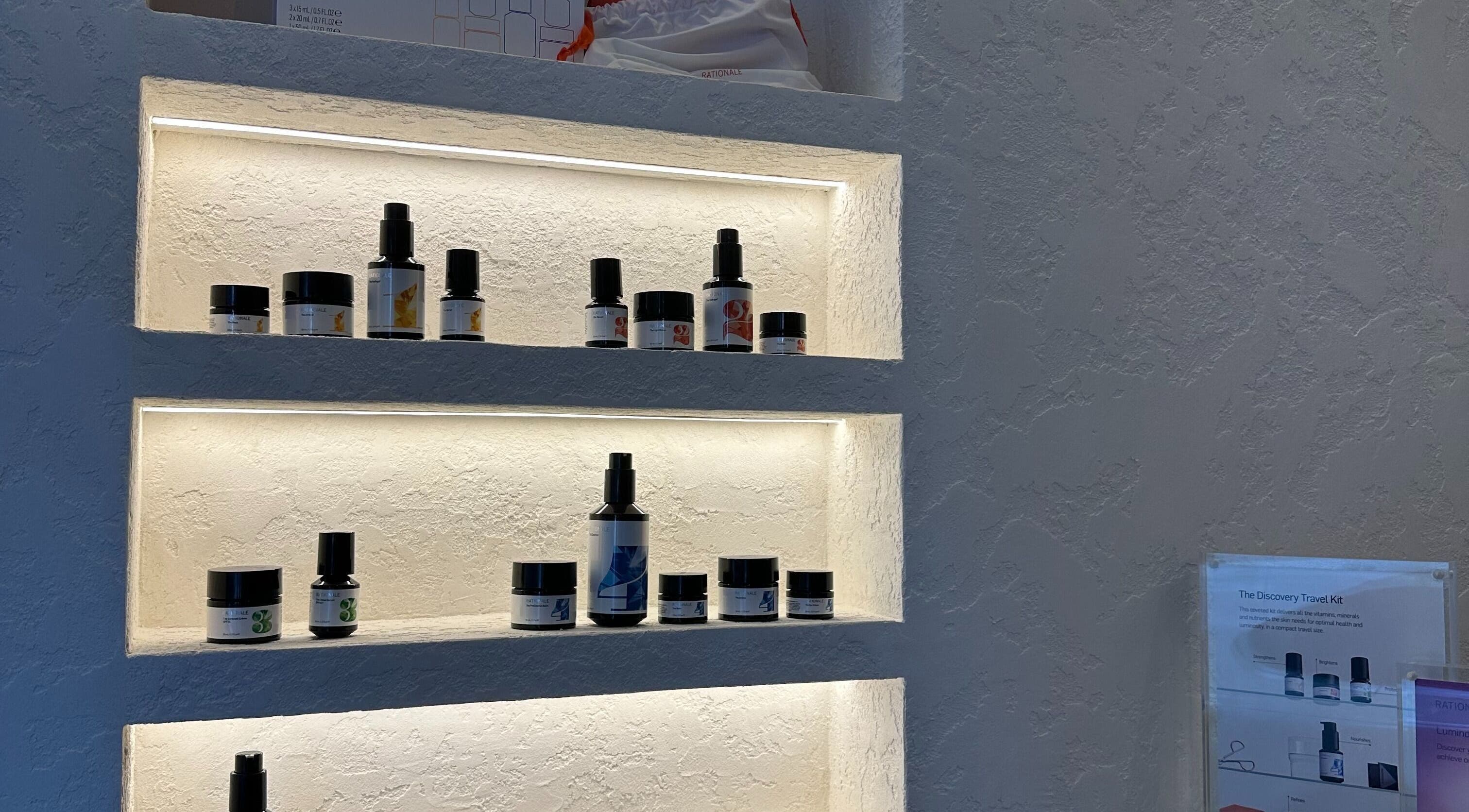 Gleaming shelves display skincare products at Dermi Skin Clinic, Melbourne, Victoria, AU.