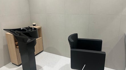 Modern wash station at Lorraines hair station, Dublin, County Dublin, IE. Black basin and chair.