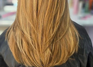 Sleek, golden hair styled at ShanayaOakes.hair in Bath, England, GB showcases expert salon finish.