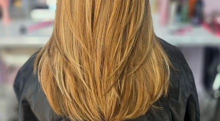 Sleek, golden hair styled at ShanayaOakes.hair in Bath, England, GB showcases expert salon finish.