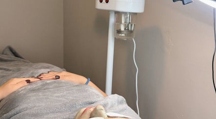 Facial treatment at BARE AIMÉ in Leeuwarden, Friesland, NL, showcasing relaxation under a cozy blanket.