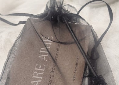 Elegant mesh bag with BARE AIMÉ branding at Leeuwarden, Friesland, NL, showcasing beauty essentials.