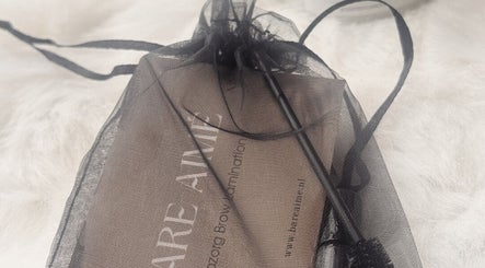 Elegant mesh bag with BARE AIMÉ branding at Leeuwarden, Friesland, NL, showcasing beauty essentials.