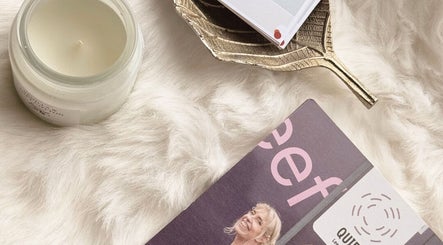 Elegant decor at BARE AIMÉ, Leeuwarden, Friesland, NL, featuring a candle on a soft fur surface.