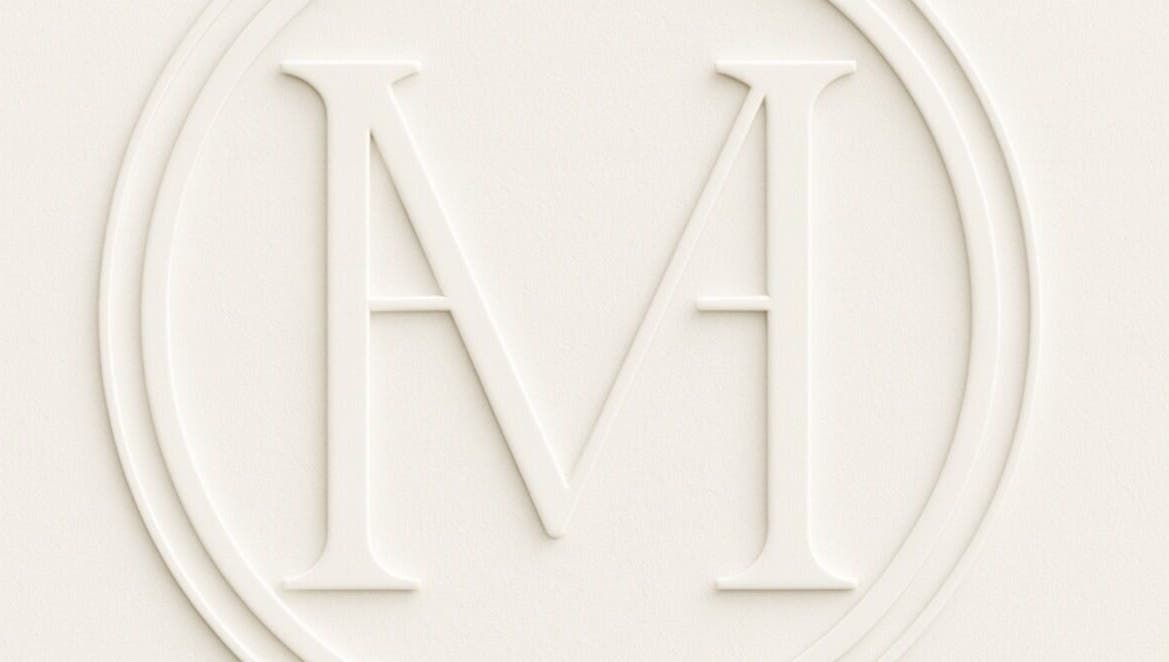 Embossed logo of Maison De Hannah, Norwest, New South Wales, AU, showcasing an elegant 'M' symbol.