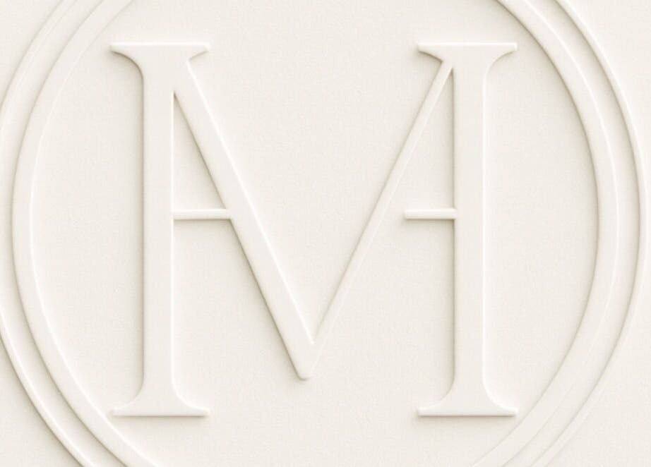 Embossed logo of Maison De Hannah, Norwest, New South Wales, AU, showcasing an elegant 'M' symbol.
