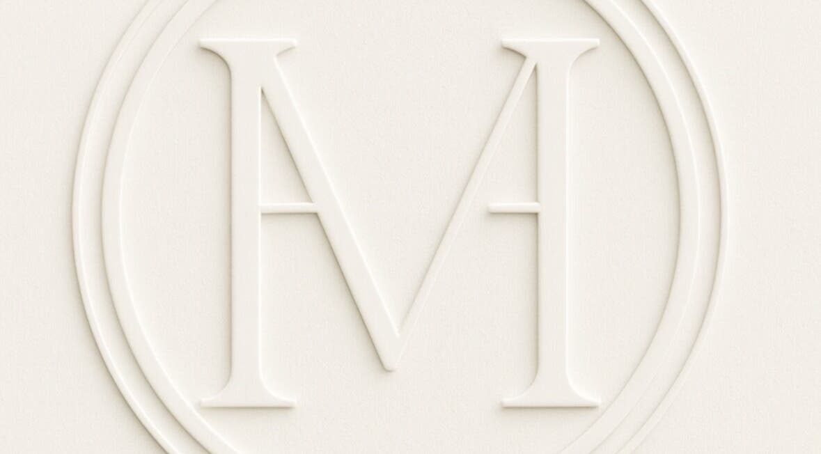 Embossed logo of Maison De Hannah, Norwest, New South Wales, AU, showcasing an elegant 'M' symbol.