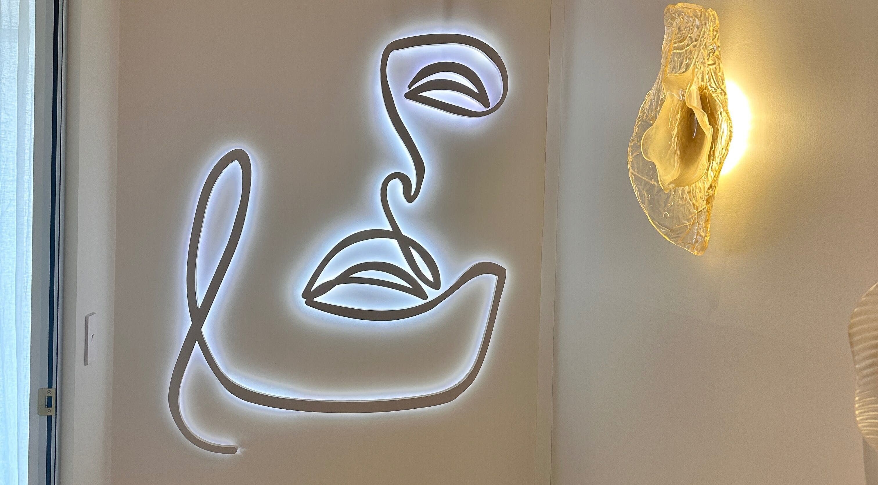 Illuminated abstract face artwork at Maison De Hannah, Sylvania Waters, New South Wales, AU.