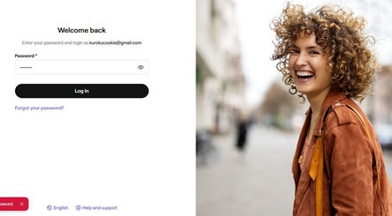 Smiling person with curly hair near Fvcndo Barbershop, Angeles, Central Luzon, PH login page.