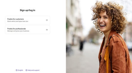 Smiling person in Fvcndo Barbershop, Angeles, Central Luzon, PH highlighting vibrant customer experience.