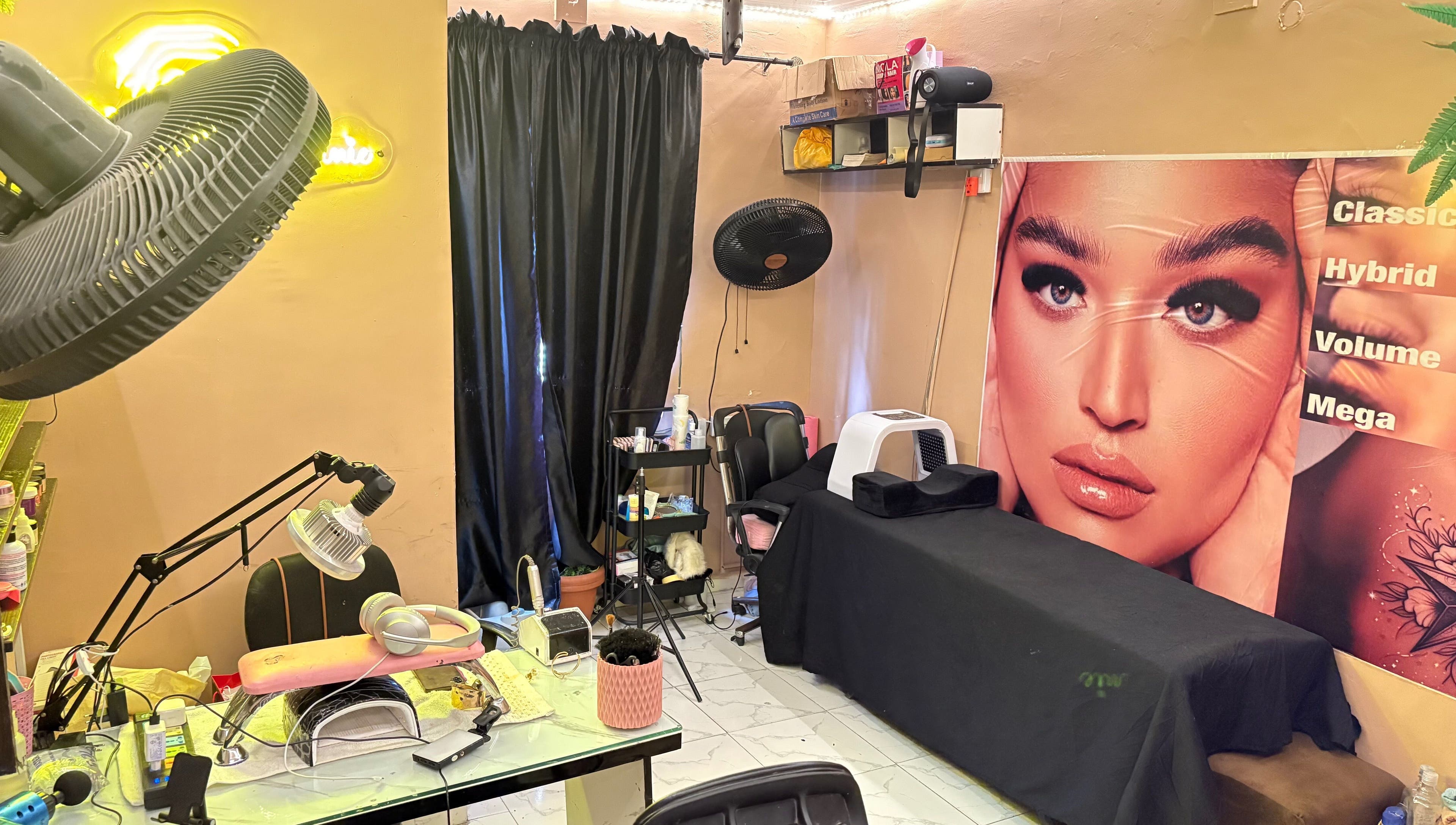 Modern beauty setup at Nailed by Ronnie in Ikeja, Lagos, NG featuring nail and eyelash stations.