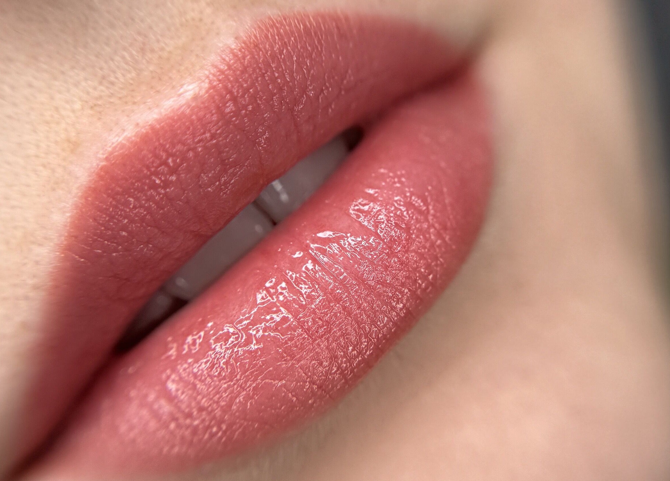 Close-up of glossy lips at Touch of Elegance, Colchester, England, GB.