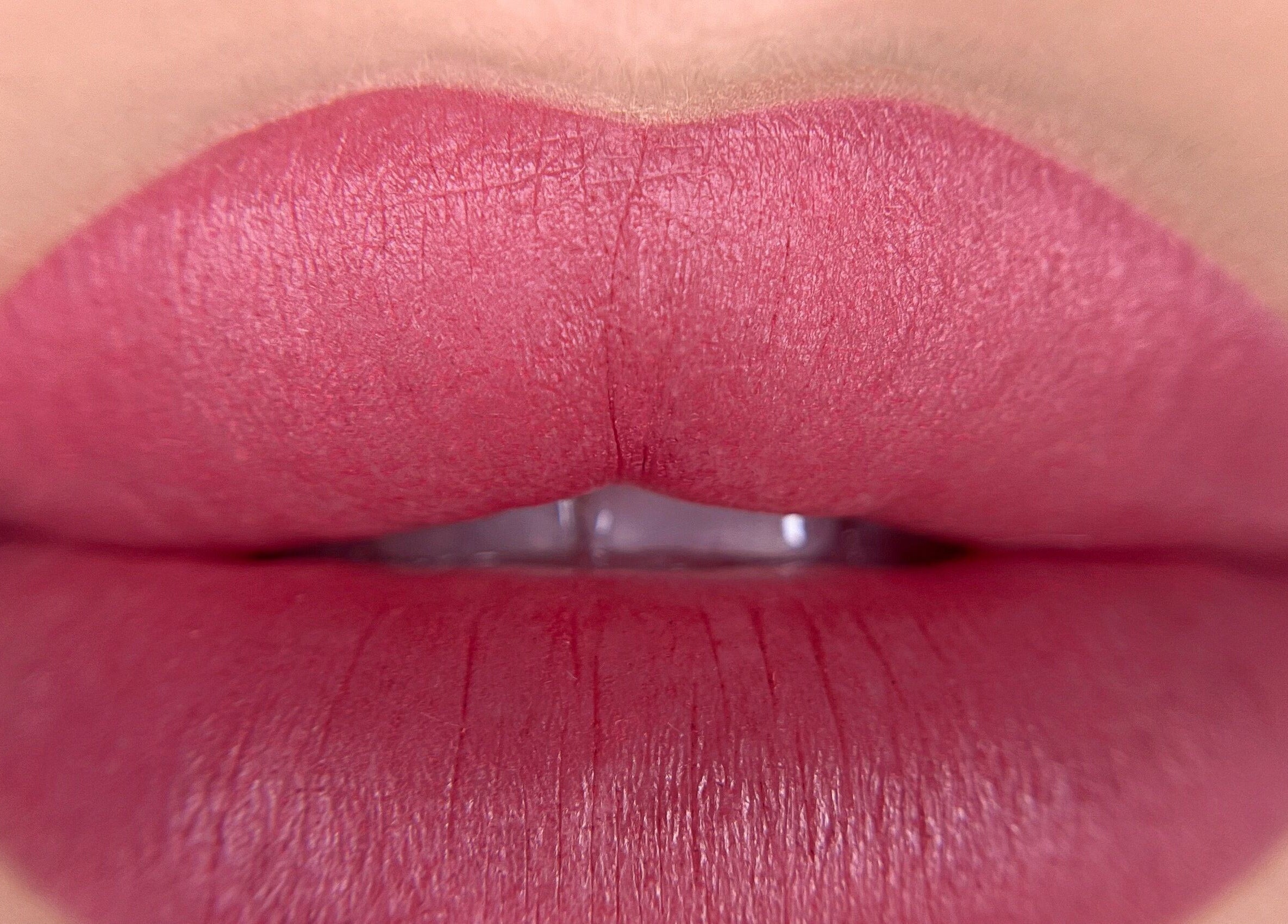 Close-up of vibrant pink lips at Touch of Elegance, Colchester, England, GB.