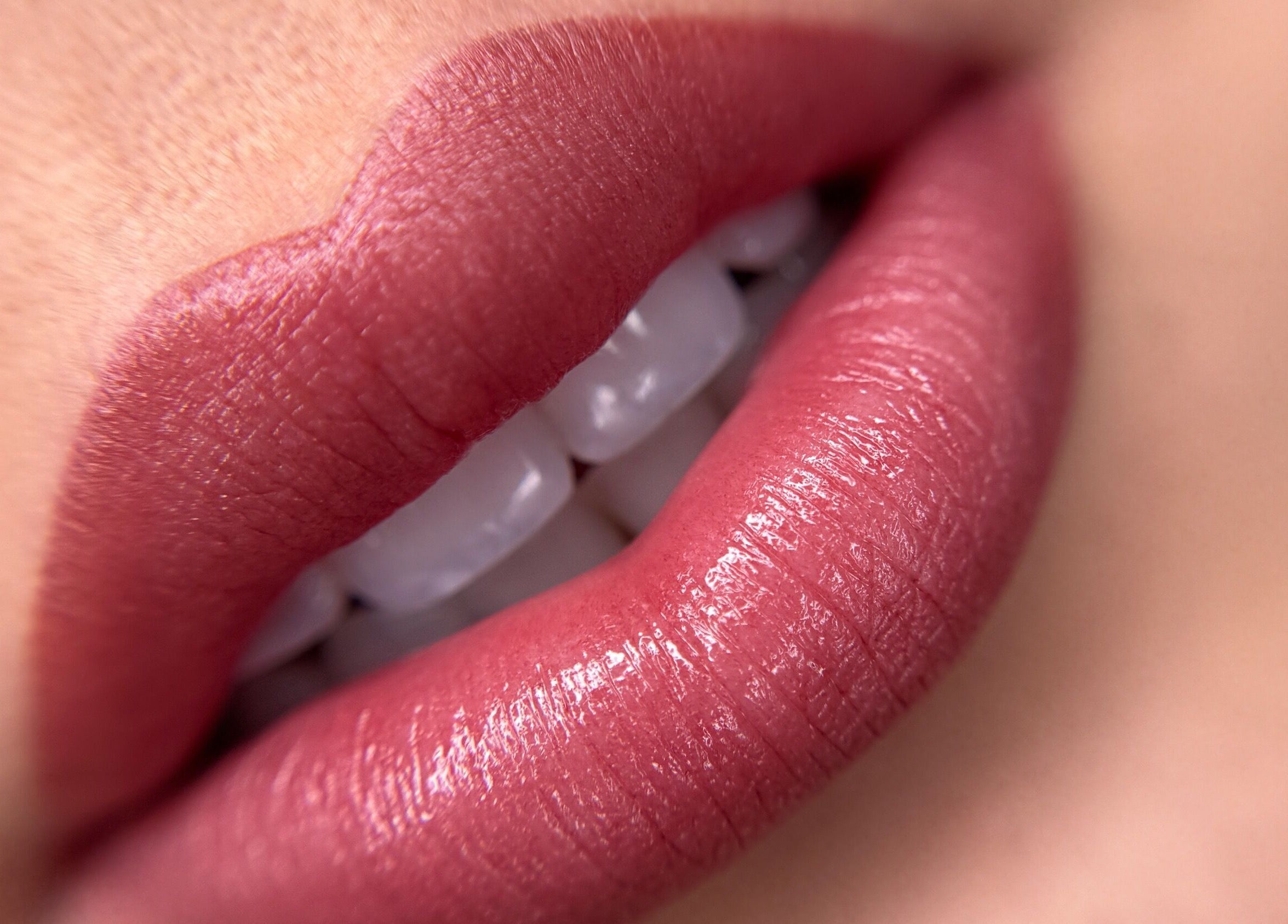 Closeup of glossy lips showcasing beauty service at Touch of Elegance, Colchester, England, GB.