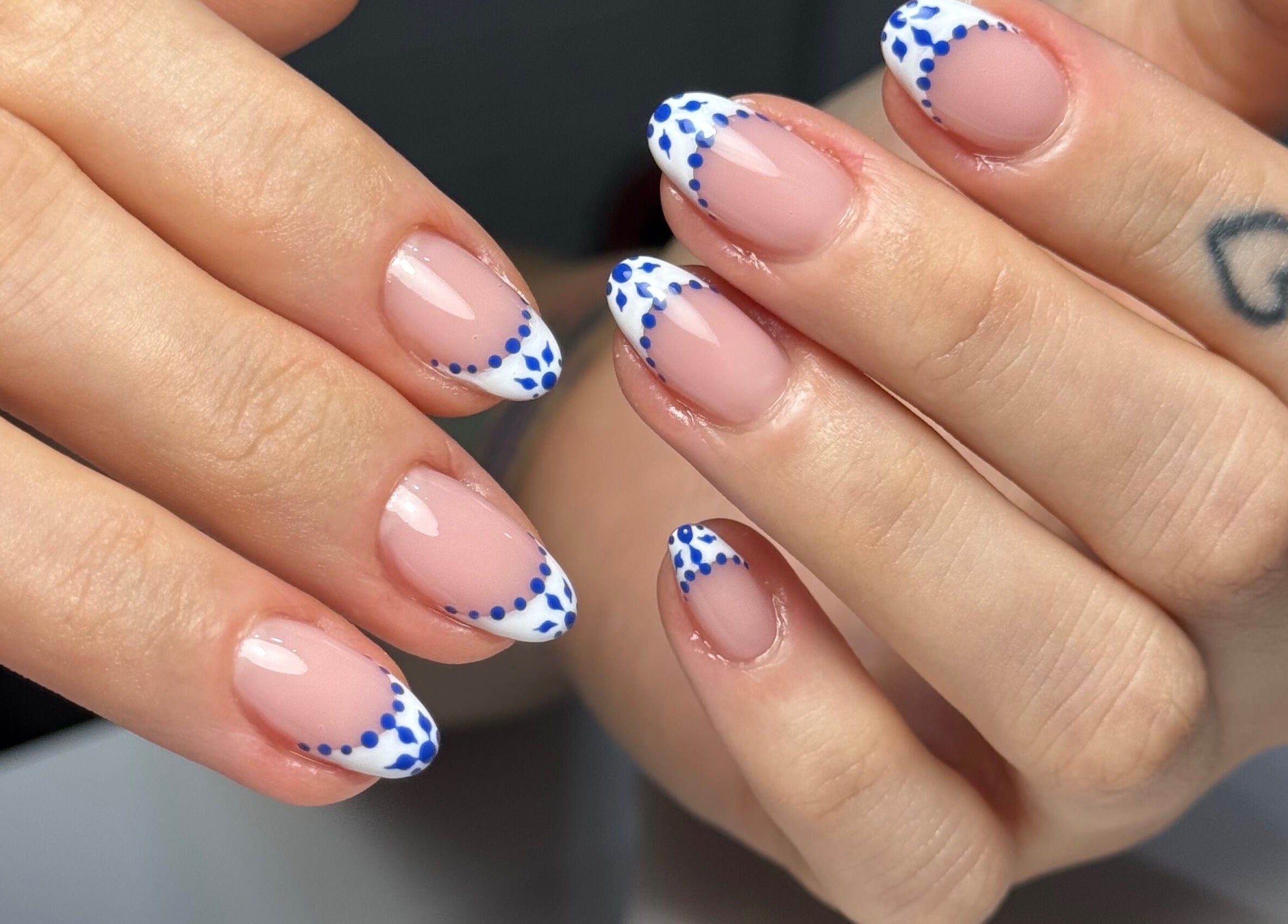 Elegant blue and white dotted nails at Touch of Elegance, Colchester, England, GB.