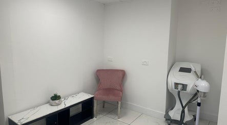Modern treatment room at Aesthetic Beauty Clinic, Kingston Upon Thames, England, GB with sleek equipment.