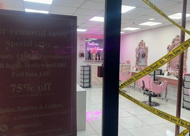 Entrance of Aesthetic Beauty Clinic, Kingston Upon Thames, England, GB, showcasing stylish pink salon interior.