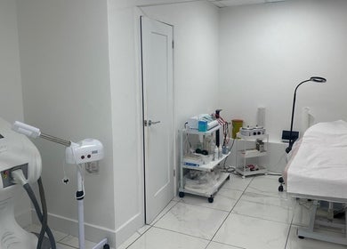 Treatment room at Aesthetic Beauty Clinic, Kingston Upon Thames, England, GB, equipped with modern wellness devices.