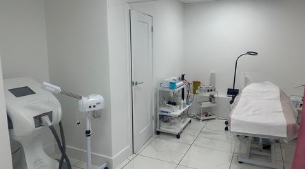 Treatment room at Aesthetic Beauty Clinic, Kingston Upon Thames, England, GB, equipped with modern wellness devices.