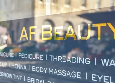 AF Beauty window sign showcasing various beauty services in Kingston Upon Thames, England, GB.