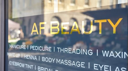 AF Beauty window sign showcasing various beauty services in Kingston Upon Thames, England, GB.