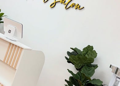 Modern reception at Uxua’s Nail Salon, Clifton, New Jersey, US, featuring sleek decor and indoor plant.