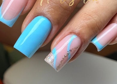 Stylish blue and glitter nails at Uxua’s Nail Salon, Clifton, New Jersey, US.