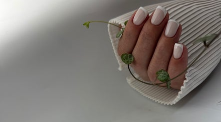 Elegant French manicure at DK Nail Aesthetician in Sutton, England, GB with delicate white tips.